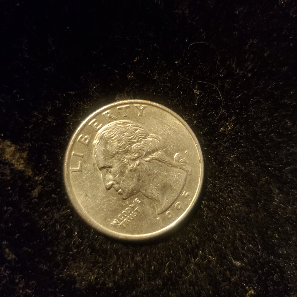 Liberty Silver Coin on Dark Background